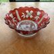 Red and transparent glass bowl with floral motifs and vintage wheat cobs