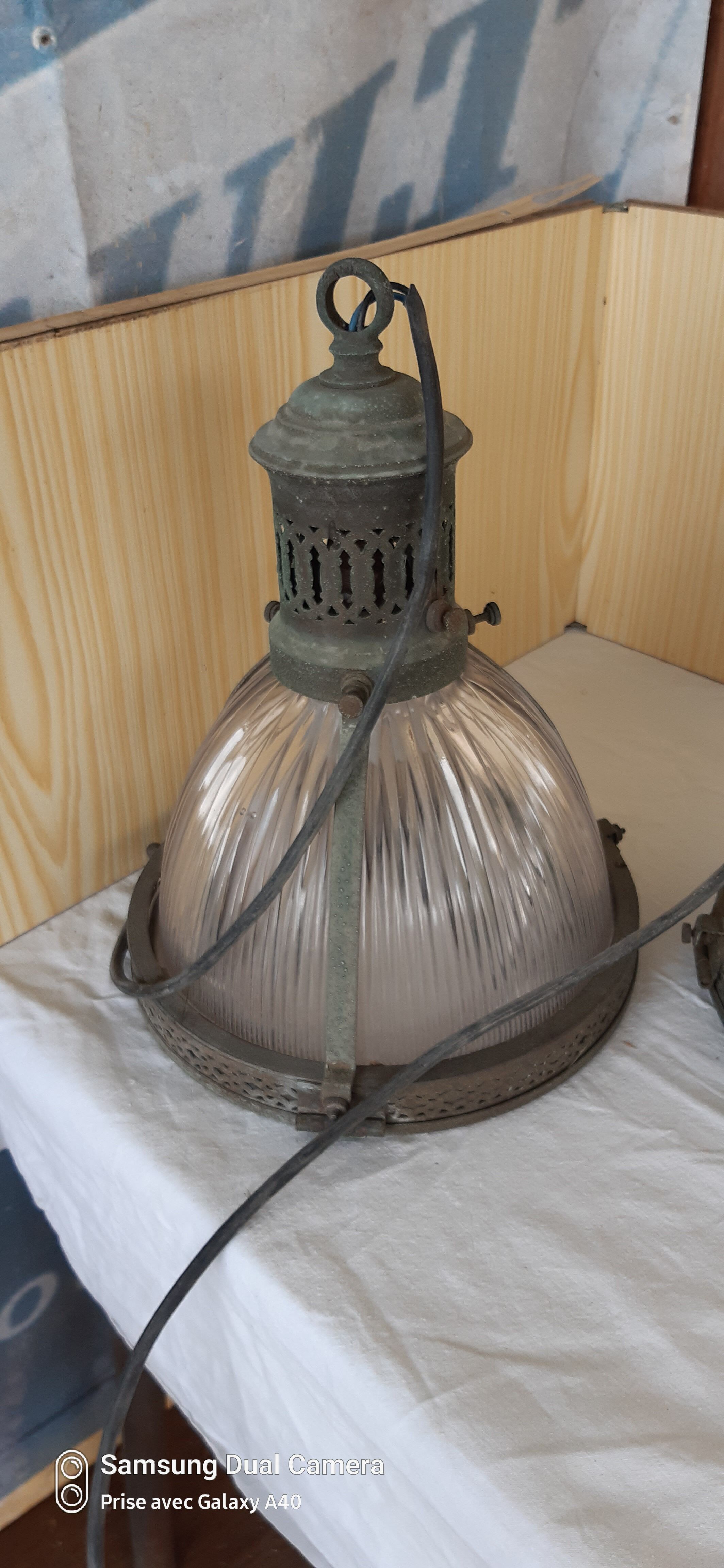 2 holophanous industrial lamps