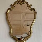 Old baroque style wall mirror with golden moldings