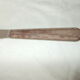 Set of knives with brown Bakelite handles.