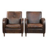 Set of two vintage sheepskin leather design armchairs in a cognac colour
