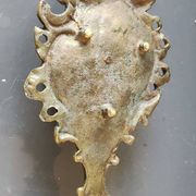 Antique Baroque/Rocaille style hand candle holder. In bronze with an old gold patina.