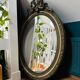 Large antique oval mirror