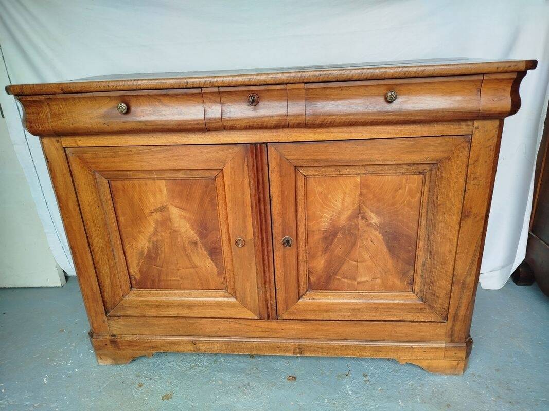Very old in solid walnut.