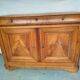 Very old in solid walnut.