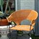 Wicker and black wrought iron armchair