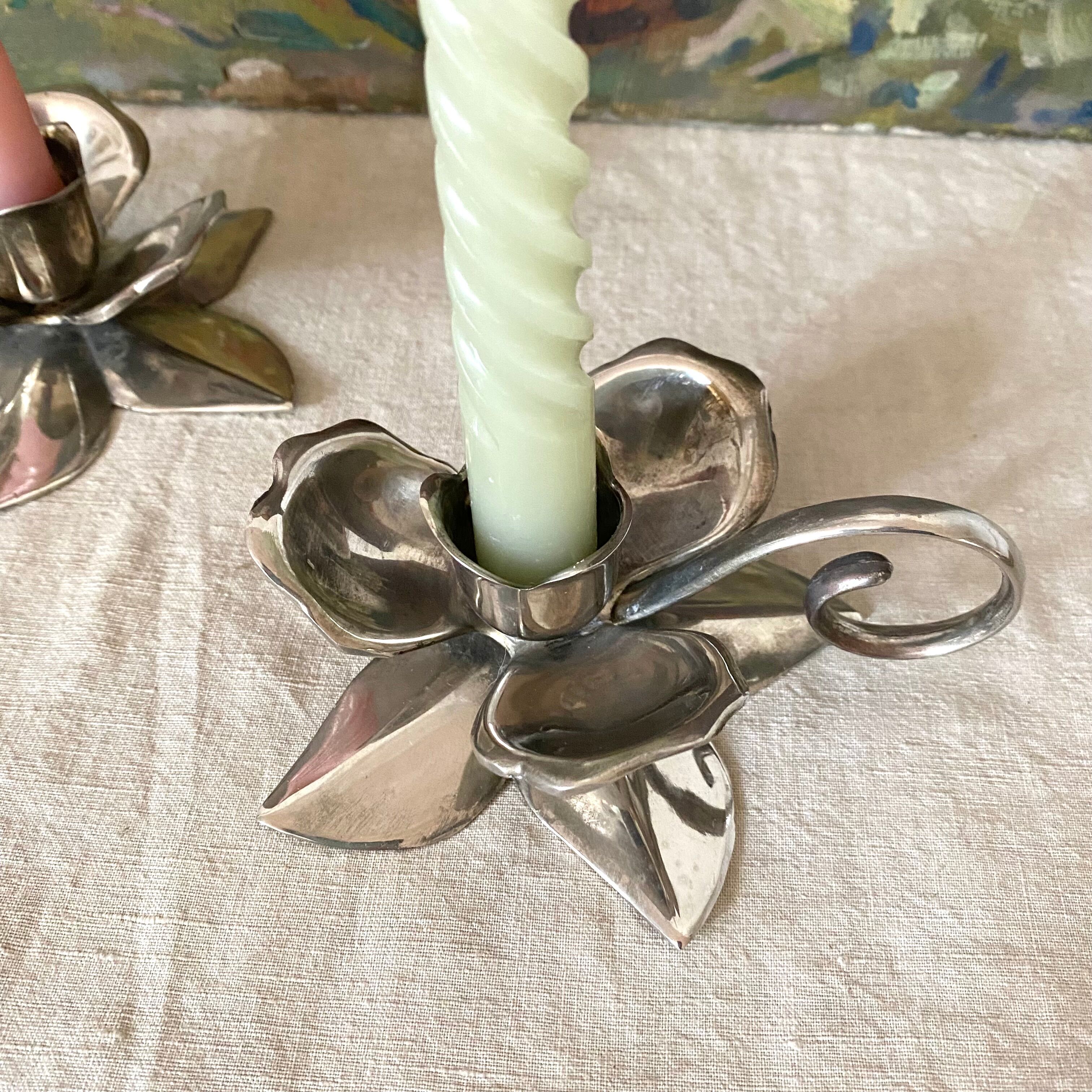 Pair of silver metal flower candle holders