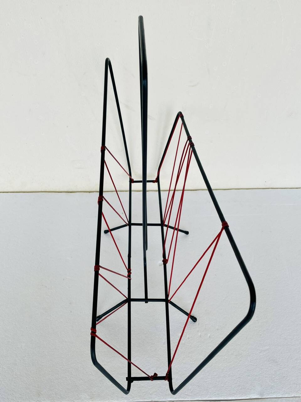 Vintage black metal magazine rack circa 19