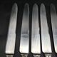 8 knives and 1 serving knife in silver metal Deetjen