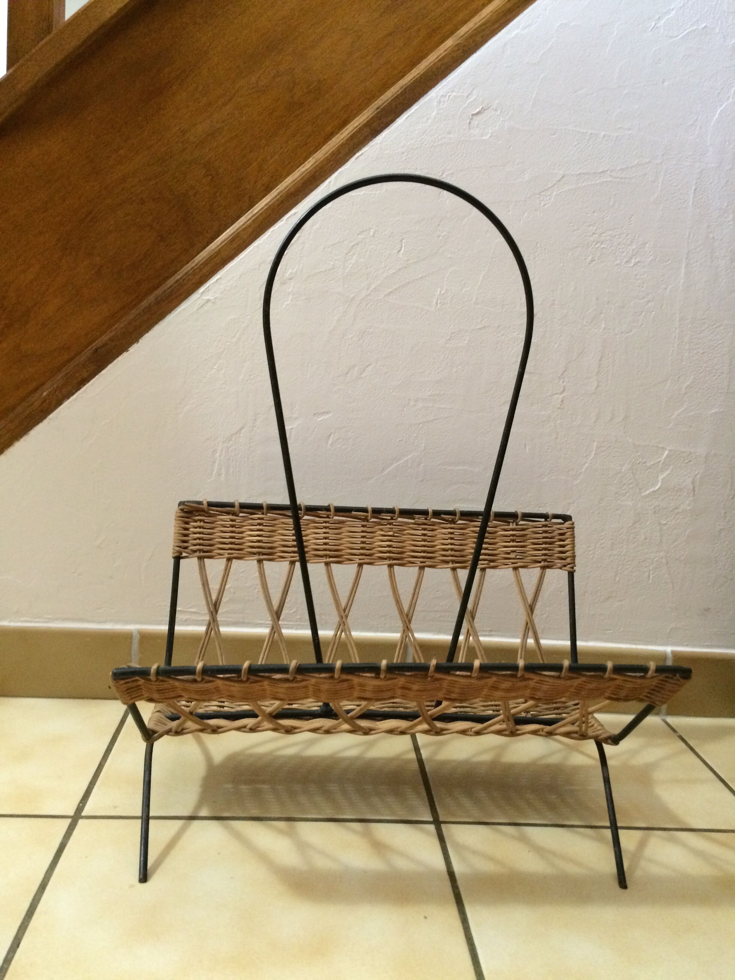 Wearing vintage rattan and black iron design magazines of the 1960s.