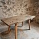 Antique work table / primitive dining table in oak, Hungary, circa 1900–1930.