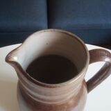 Vintage pitcher in glazed sandstone
