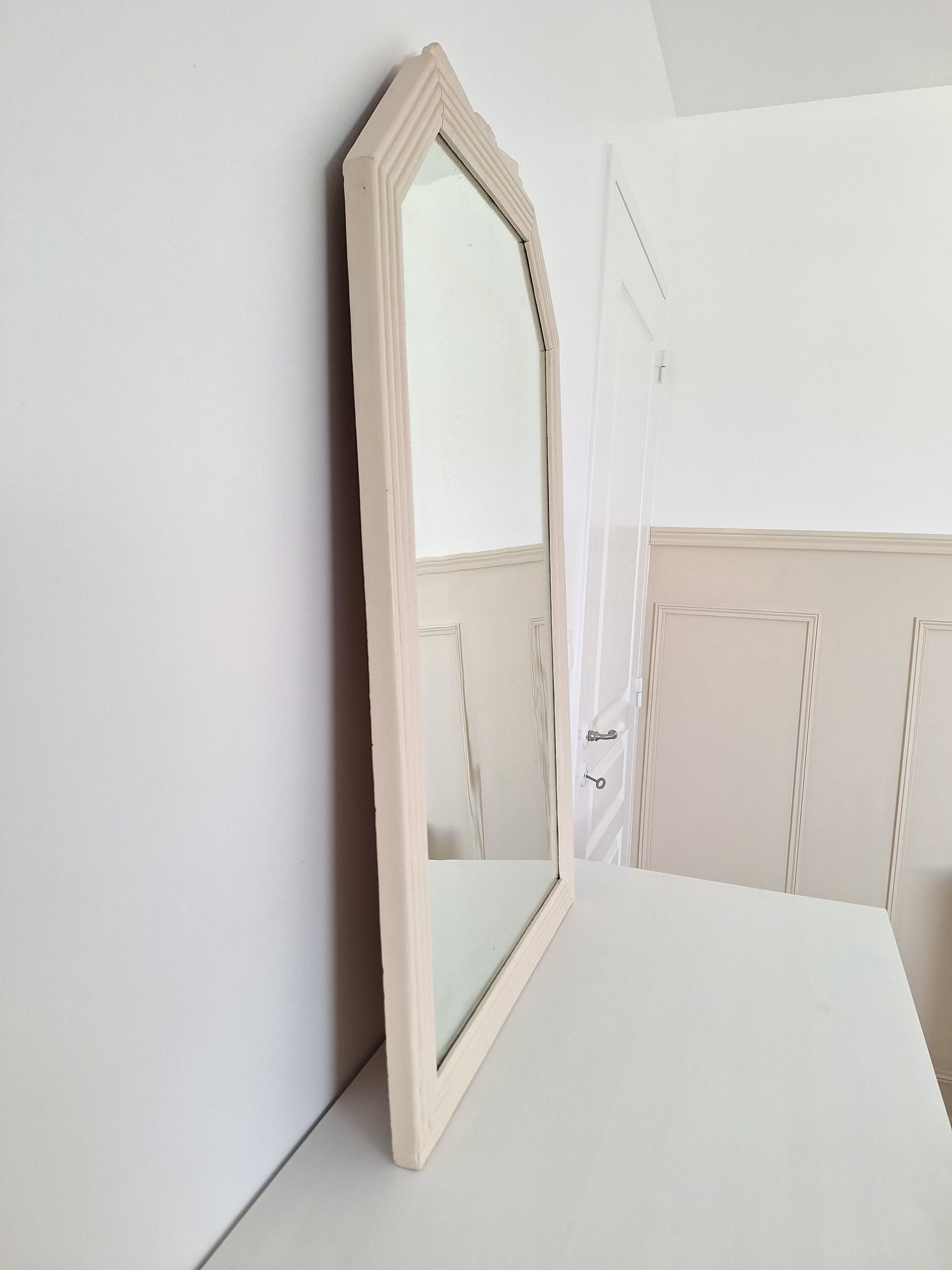 Beige bevelled and moulded mirror