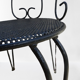 Pair of wrought iron garden chairs