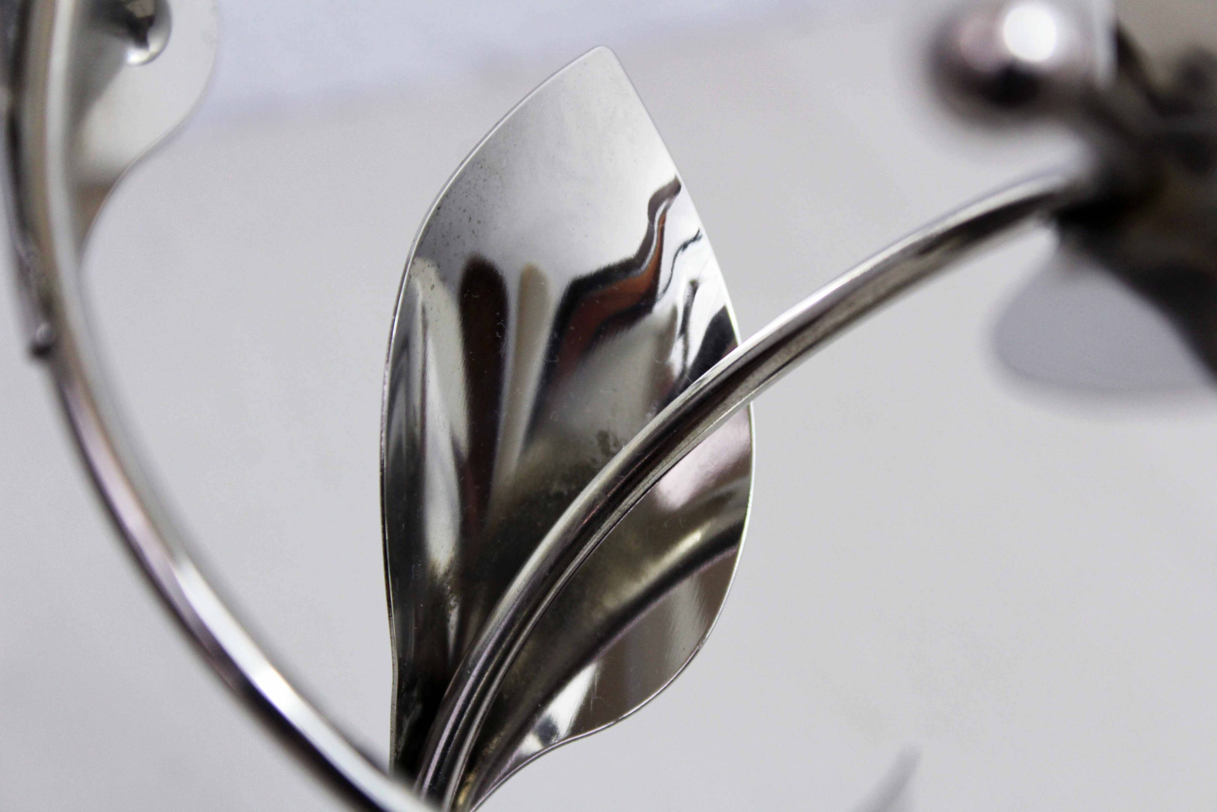 Chrome metal floral candle holder