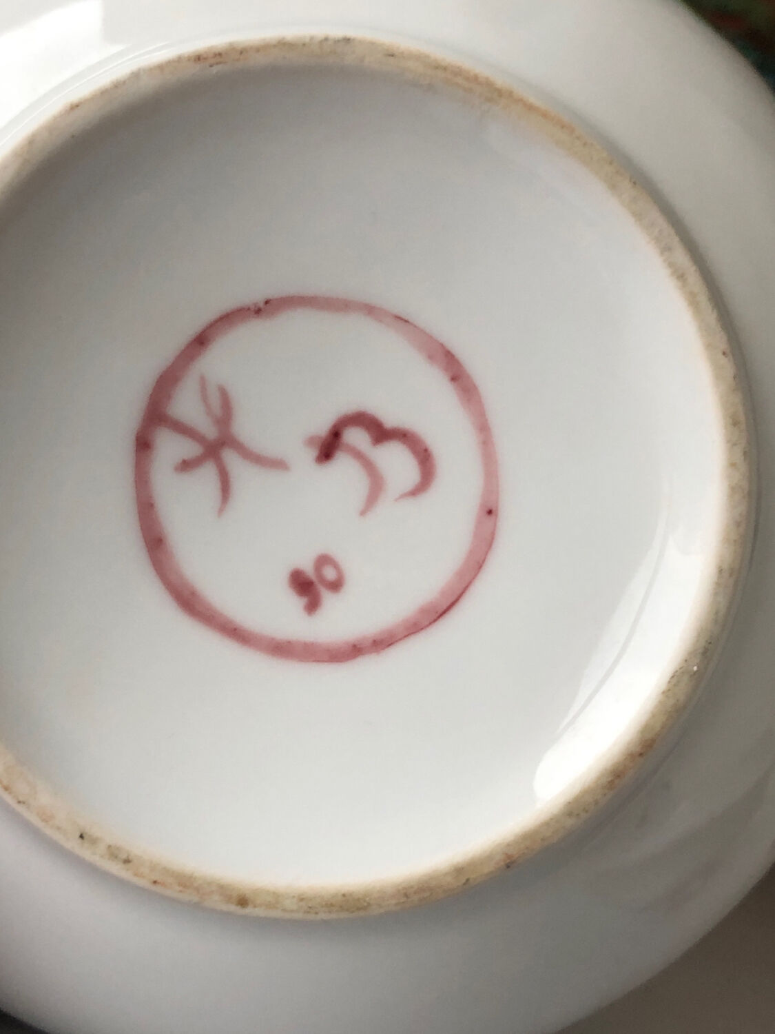 Old white and pink teapot