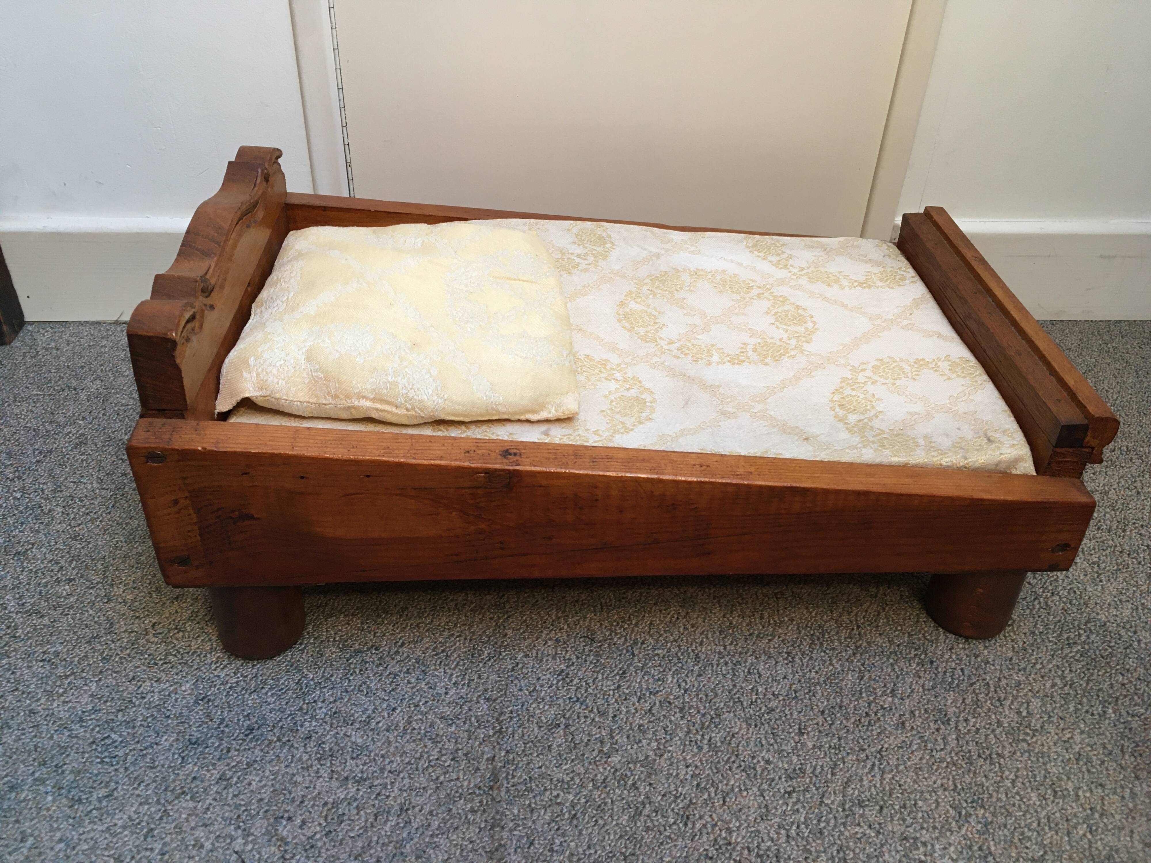 Old wooden bed for doll with mattress and pillow