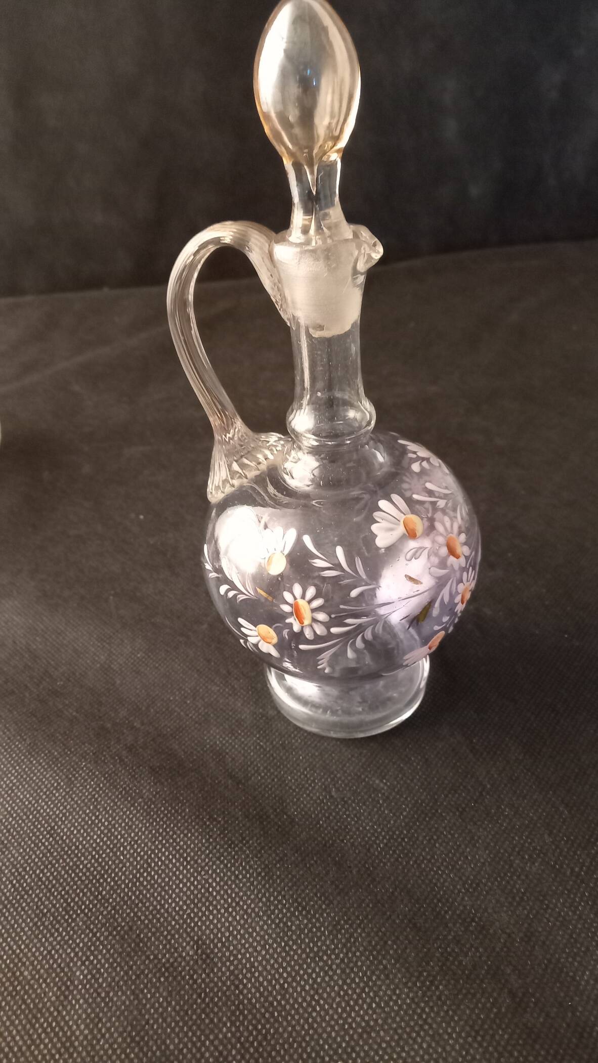 Small liqueur carafe and 7 matching painted glass glasses.