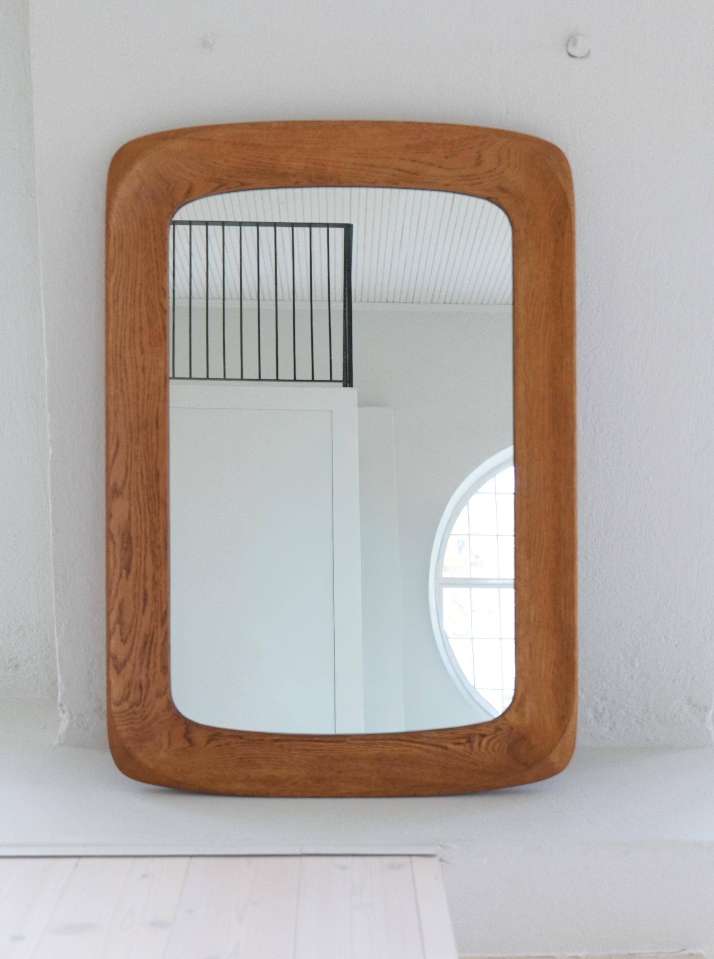 Mid-century modern sculptural wall mirror in stained oak, glass, Glas & Trä 1959
