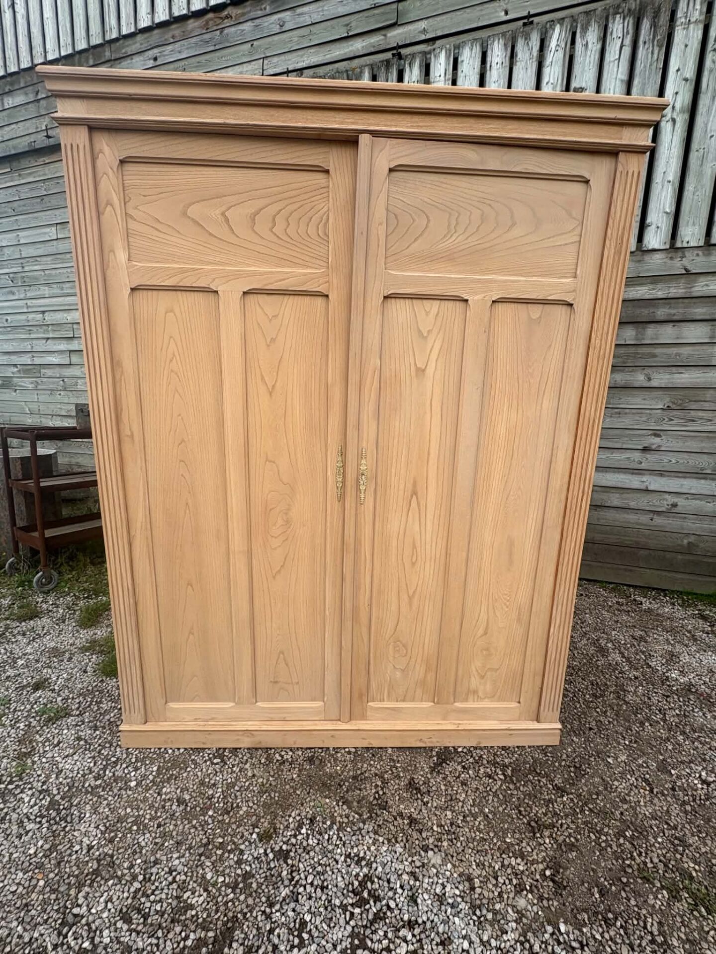 Large antique wardrobe in raw wood