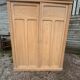 Large antique wardrobe in raw wood