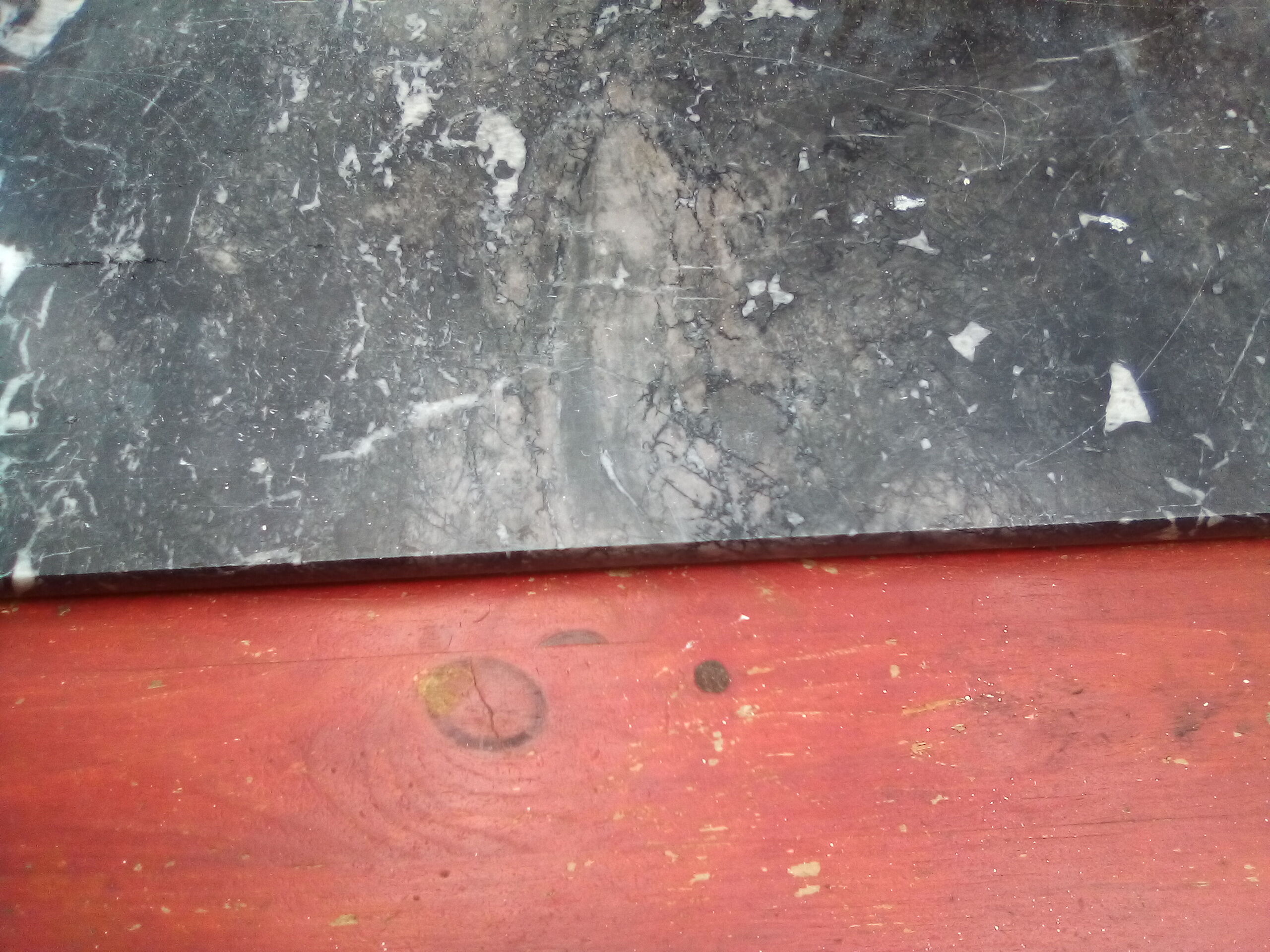 White veined black marble fireplace