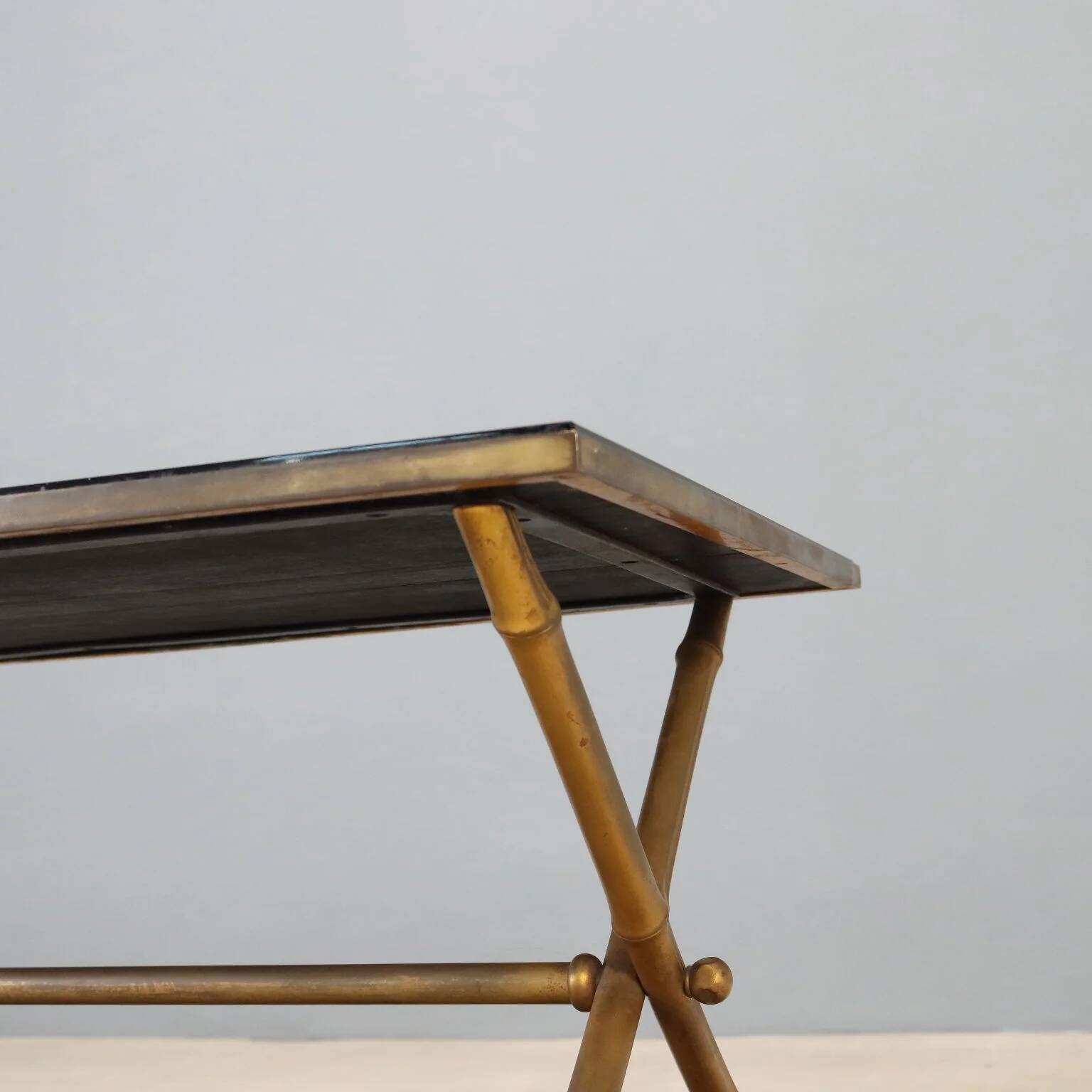 Coffee table from the 1950s-60s with a brass base.