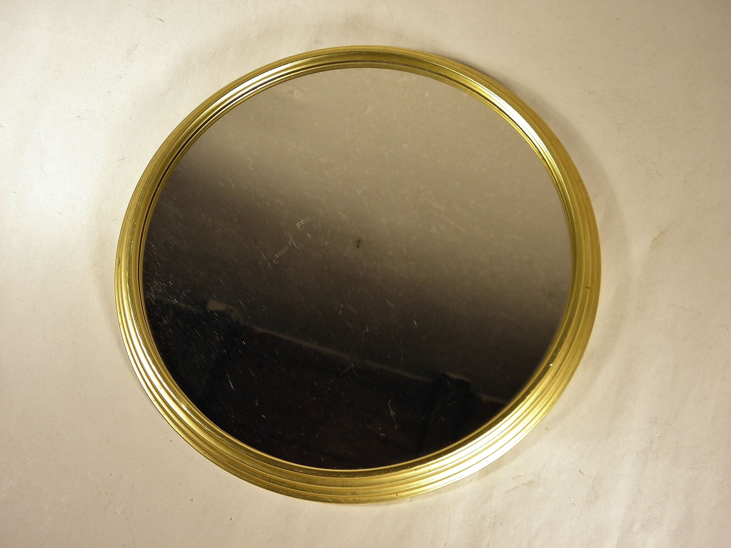 Golden round mirror