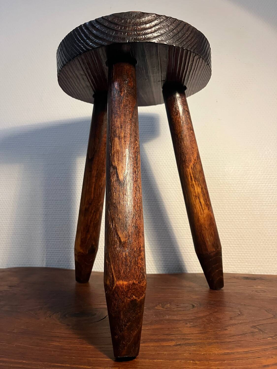 Round wooden tripod stool