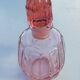Pink molded glass bottle