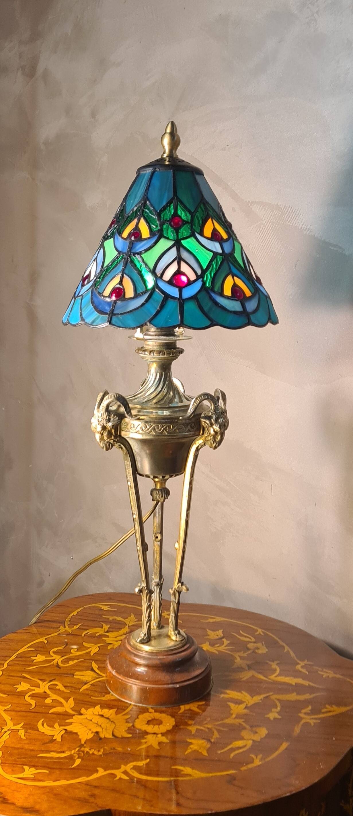 bronze lamp with a goat's head from the 19th century and a stained glass lampshade soldered with lead