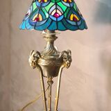 bronze lamp with a goat's head from the 19th century and a stained glass lampshade soldered with lead