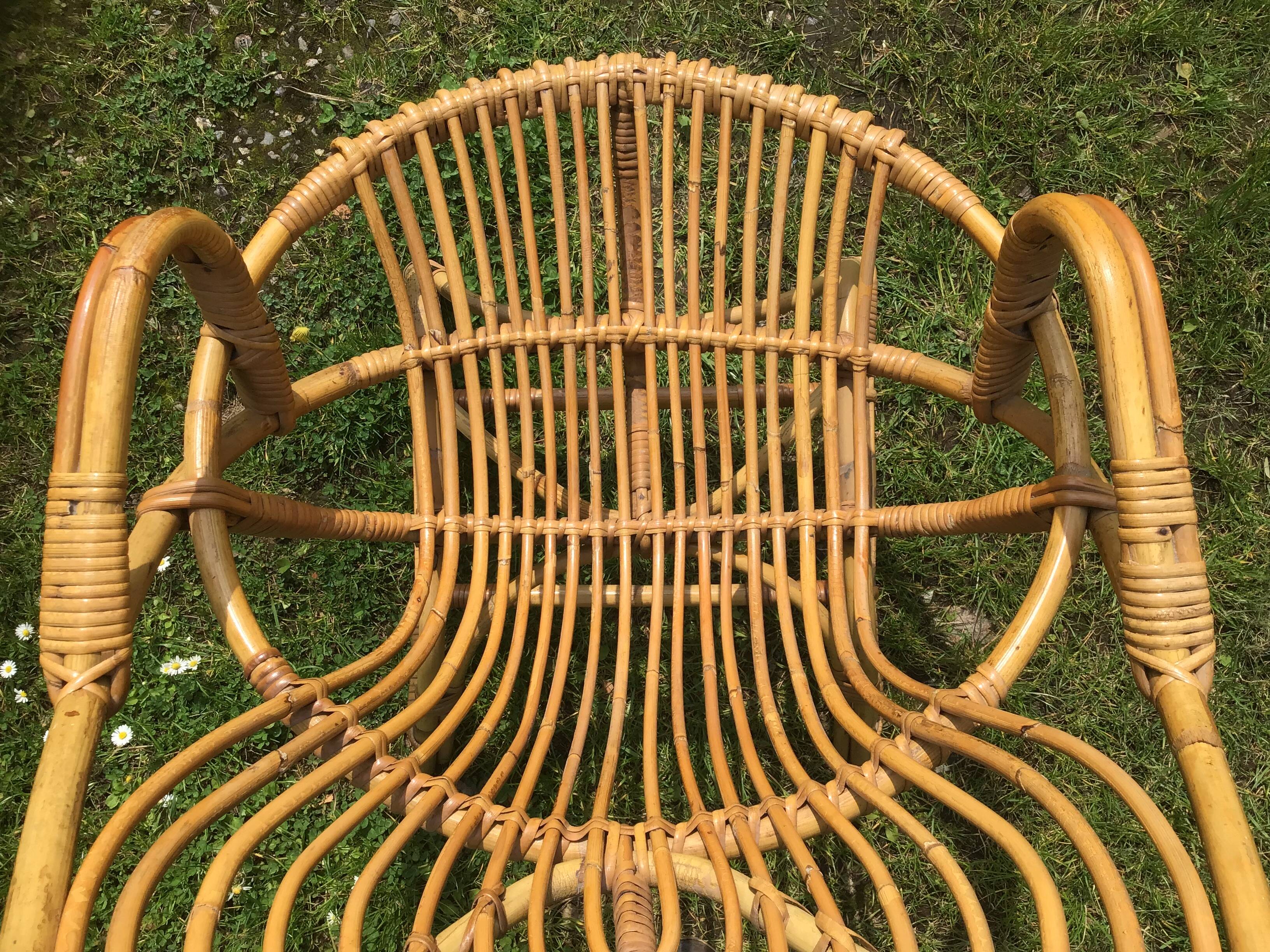 Vintage ovoid-shaped rattan armchair.