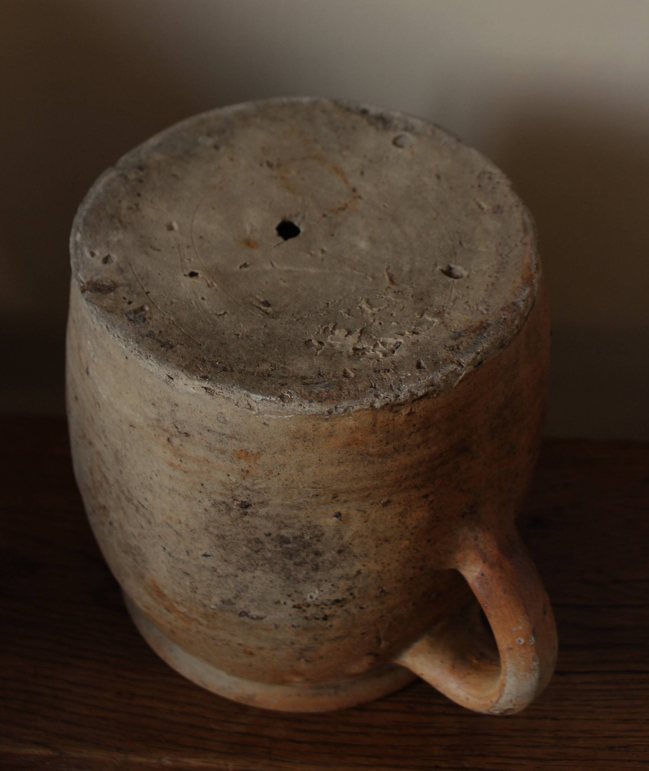 Large round terracotta pot with handle