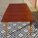 Extendable table, compass legs