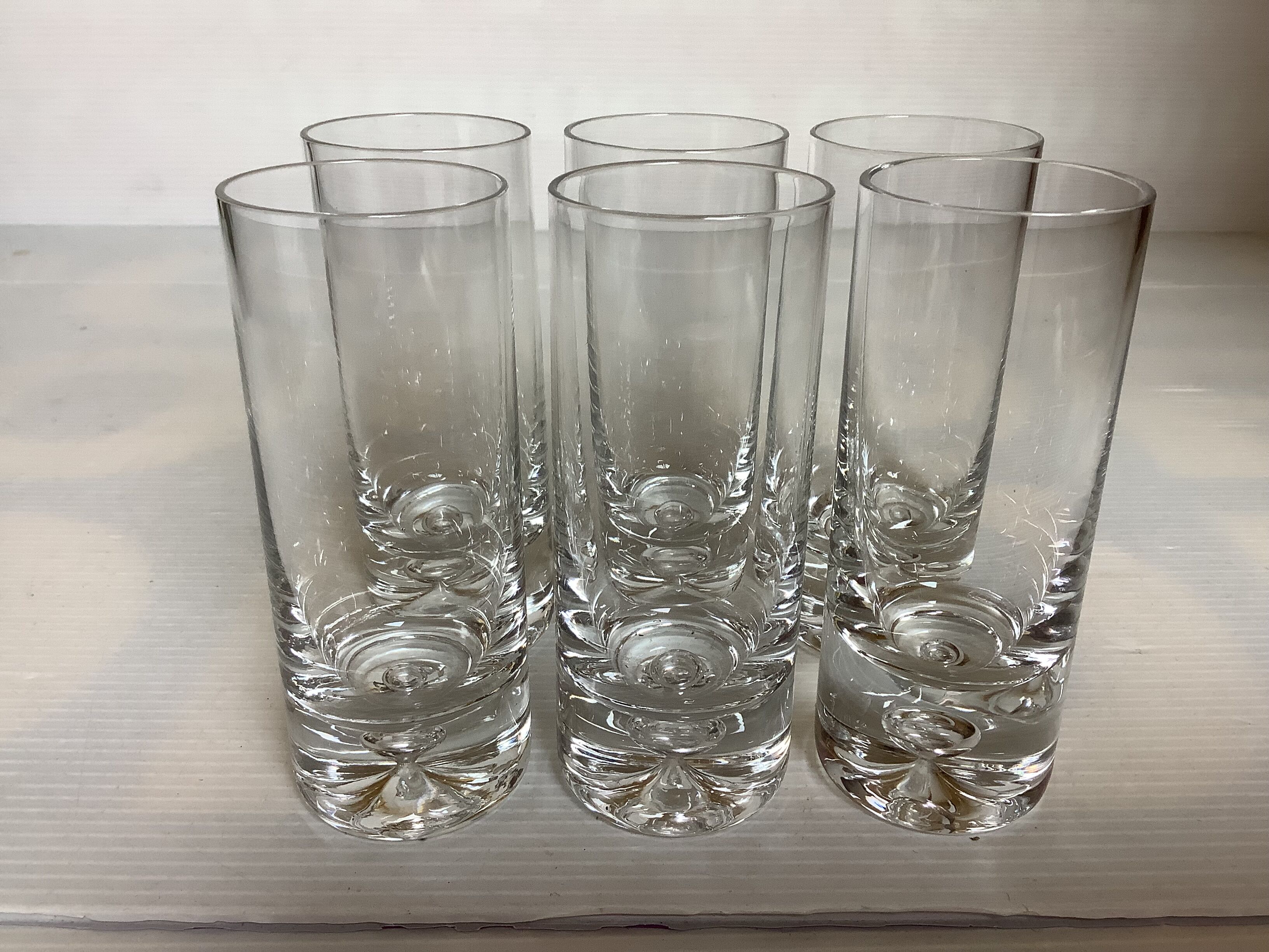 6 small bubble-footed shot glasses in Kosta Boda style.