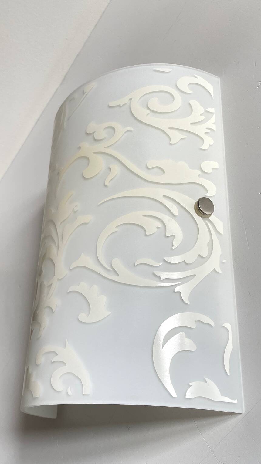 Polished and screen-printed glass sconce by eglo