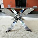 A chrome-shaped table and a 70s glass tray