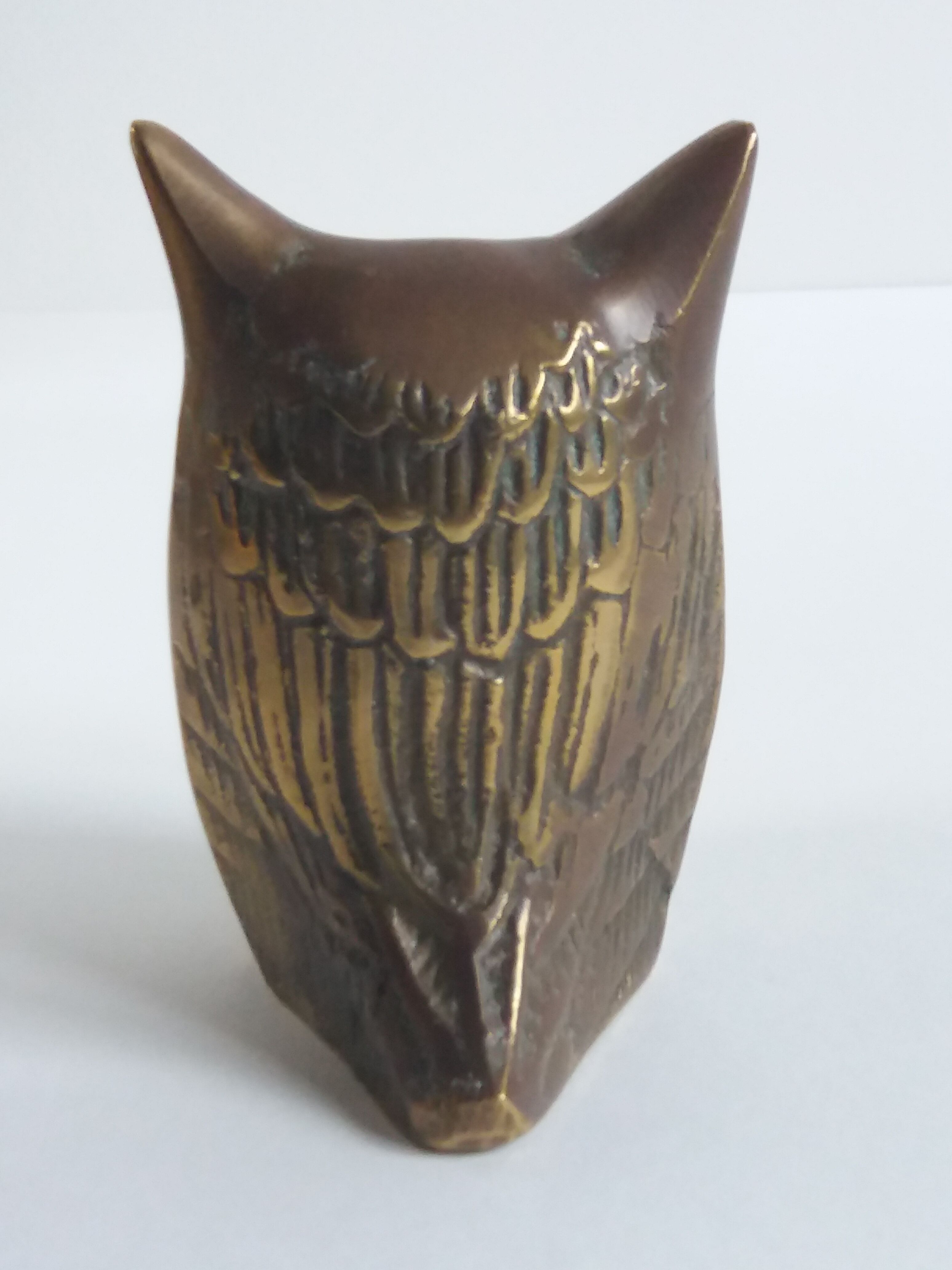 Chiseled brass owl