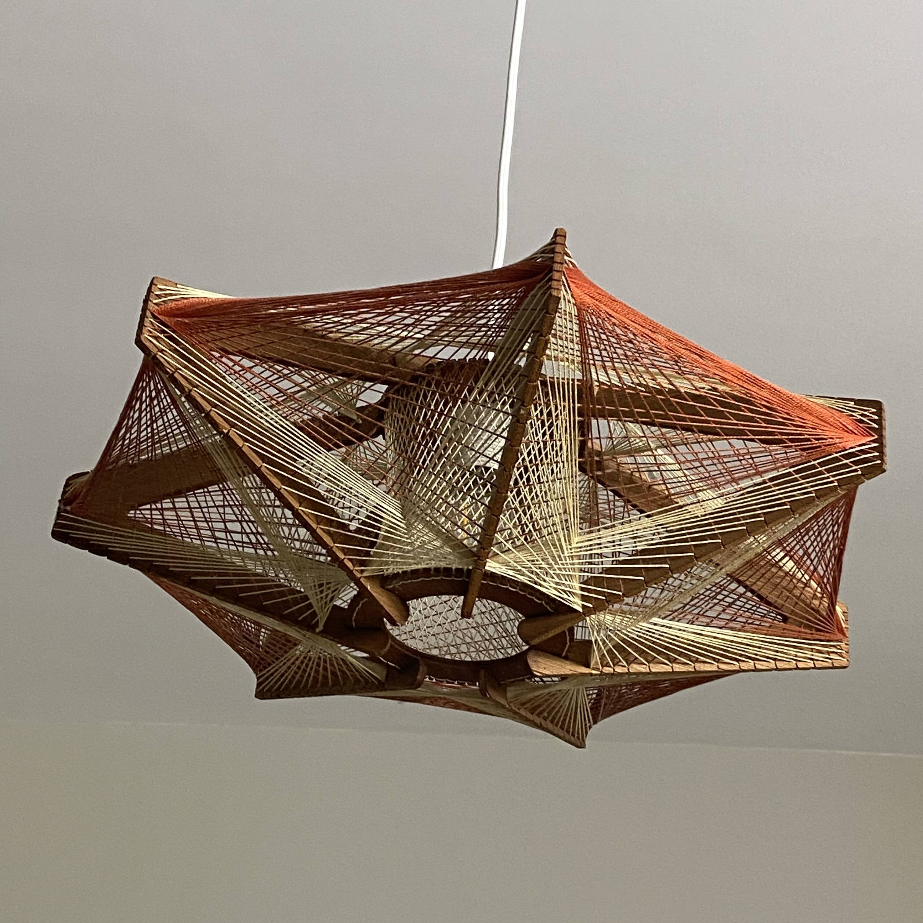 Vintage Scandinavian pendant light with stretched wires.