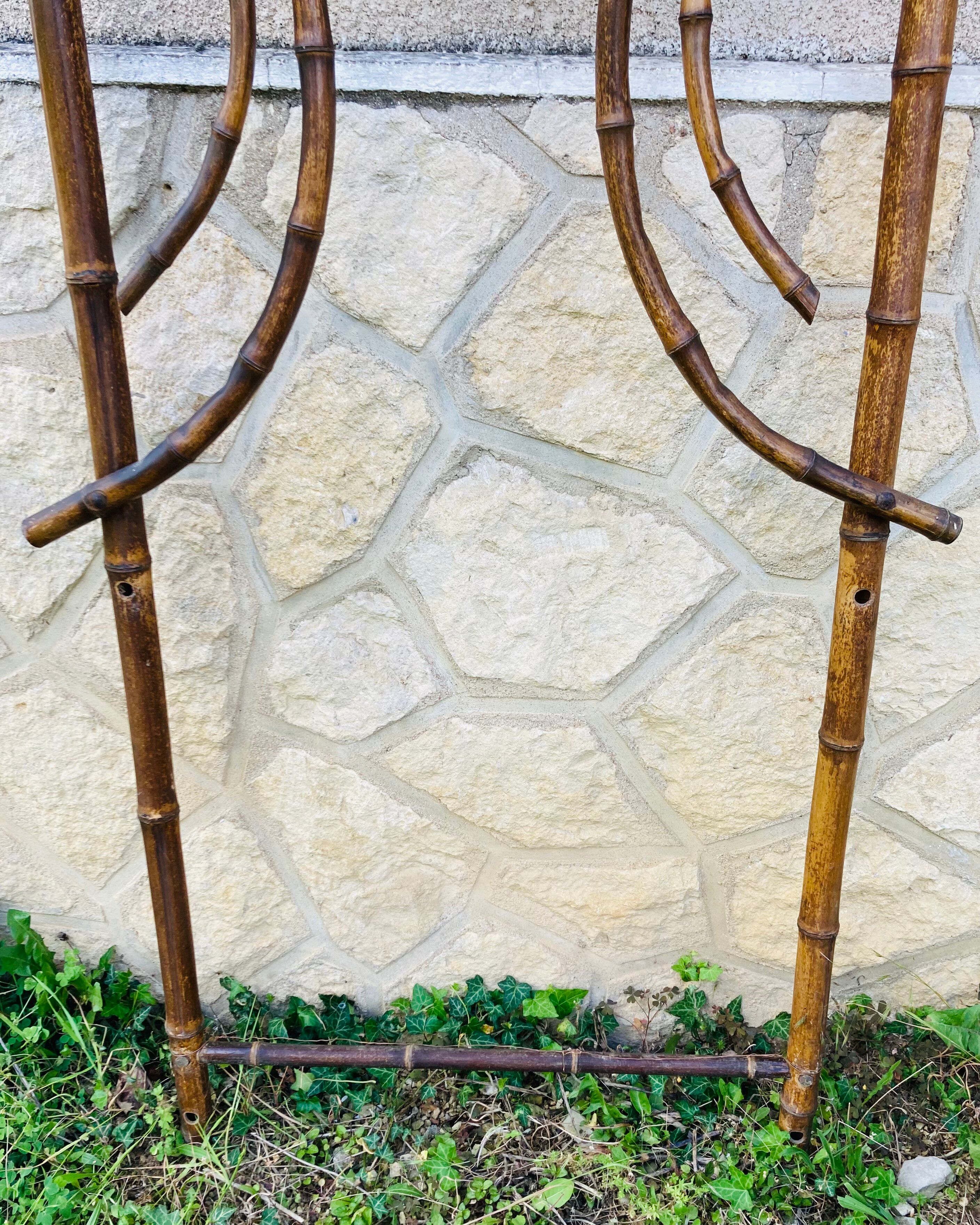 Bamboo coat rack from the 19th century, mirror in the shape of a crescent moon.