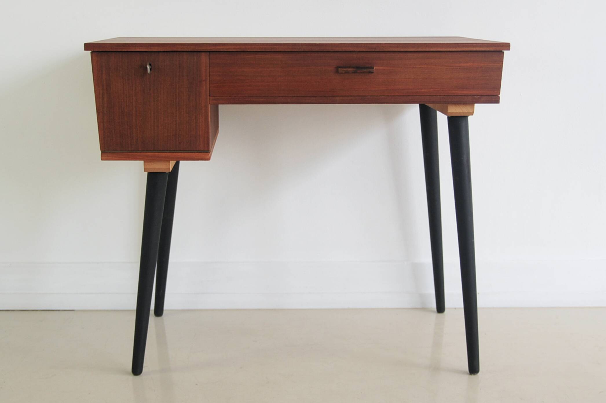 Vintage teak desk on black legs