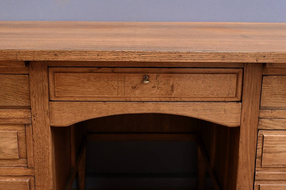 Solid oak pedestal desk, Régy establishments – 1940