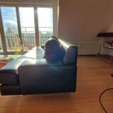 Black leather three-seater sofa