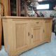 Low sideboard in light solid oak with 3 doors and 1 drawer.