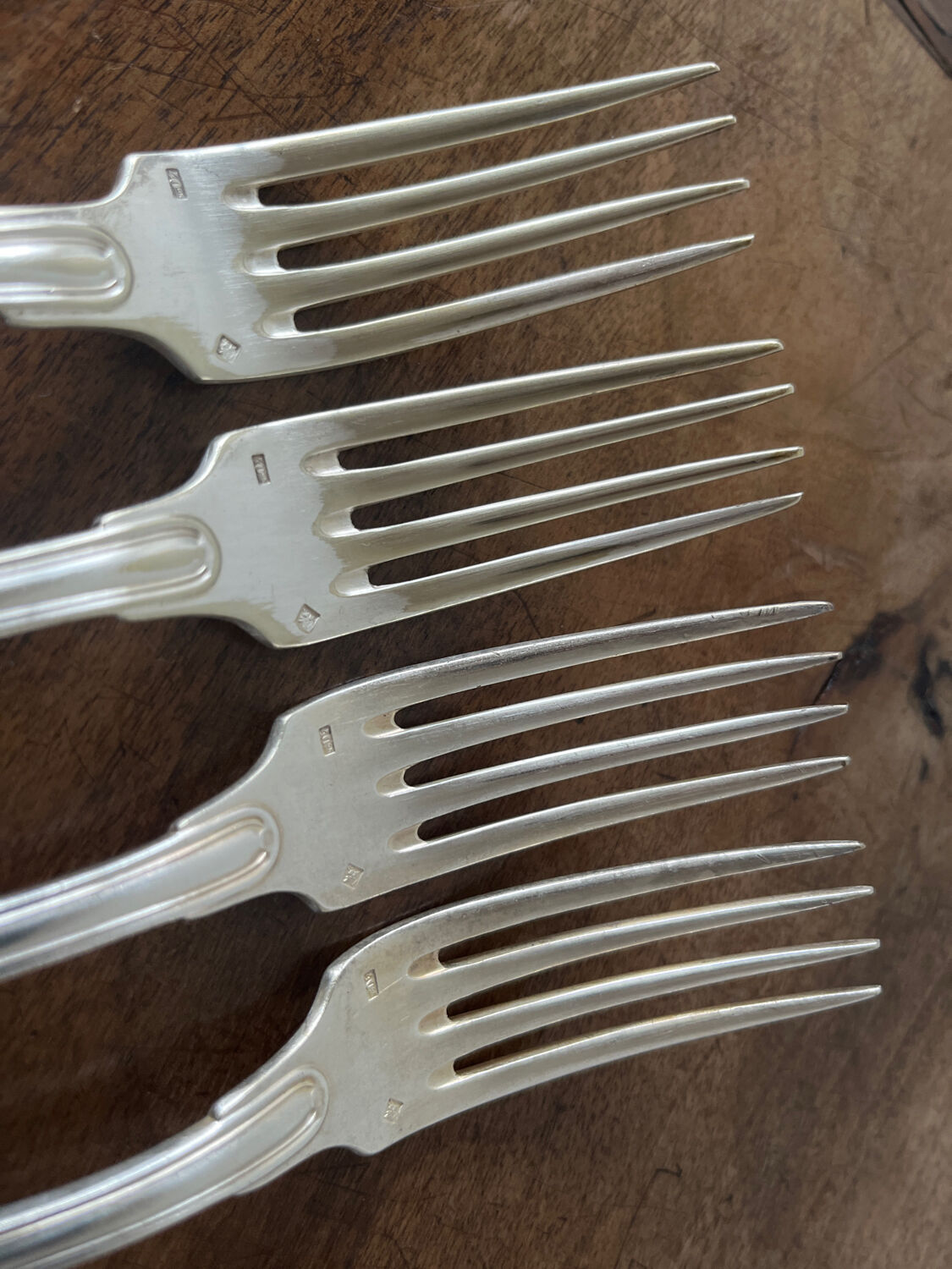 4 silver metal forks