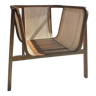 Wraparound canned back armchair sitting with teak slats