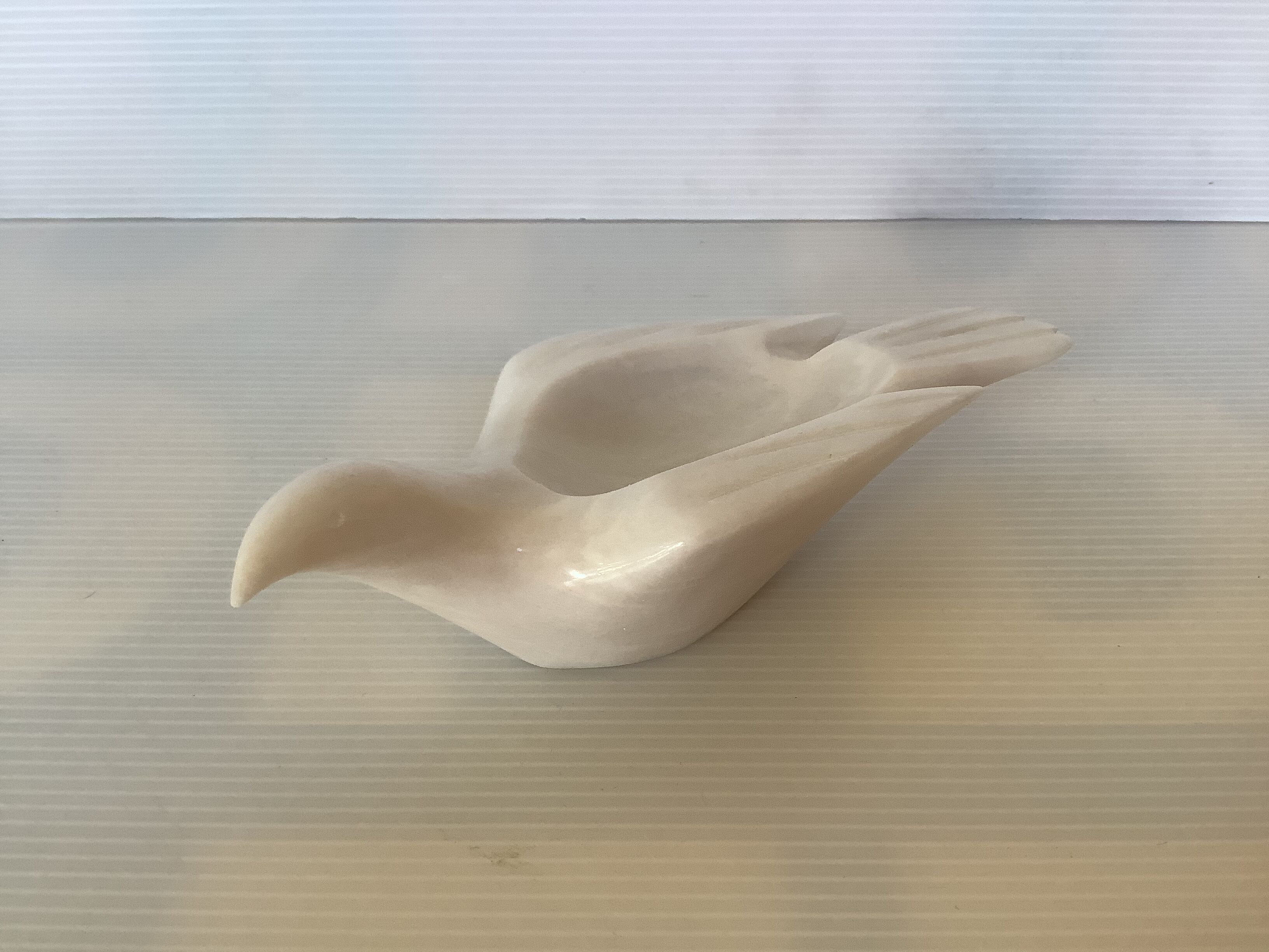 Marble bird empty pocket