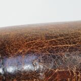 Cognac-colored vintage sheep leather wingback chair with character