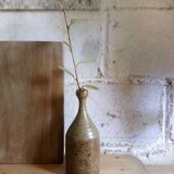 Bottled sandstone vase with a narrow neck